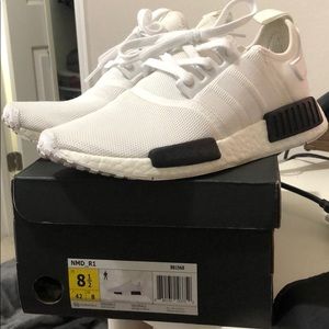 Worn. Men’s adidas NMD R1 white with black bricks.
